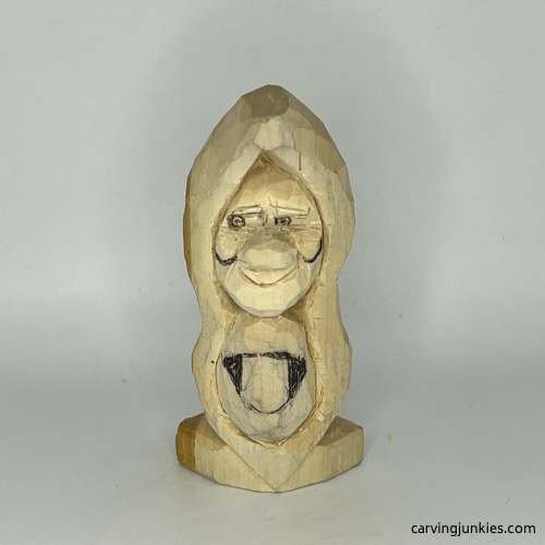 Adding cheeks on pea pod wood carving Cheeks drawn on pea pod wood carving