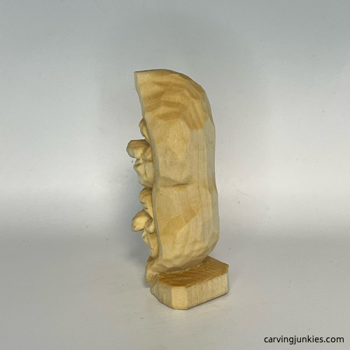 Unpainted left side of pea pod wood carving Unpainted left view of pea pod wood carving