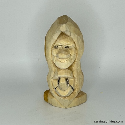 Narrowing nose on pea pod wood carving Marking wood for removal on nose of pea pod wood carving