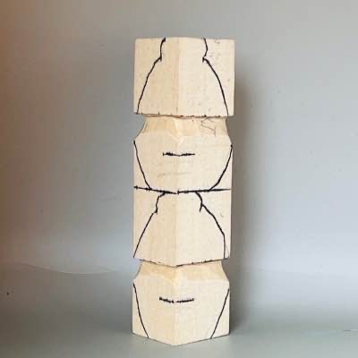 Tops are sketched on wood carved acorn