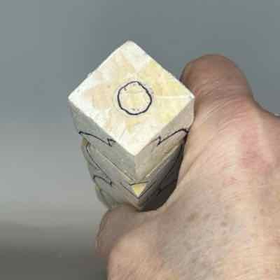 Circle guideline is drawn on top of the acorn wood carving