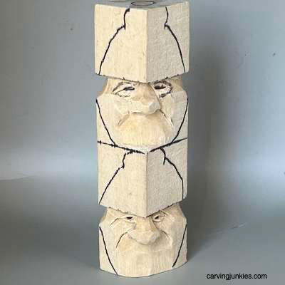 Eyelids are sketched on acorn wood carving caricature