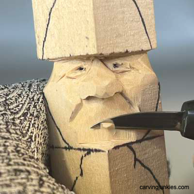 Shaping mouth bed on acorn wood carving caricature
