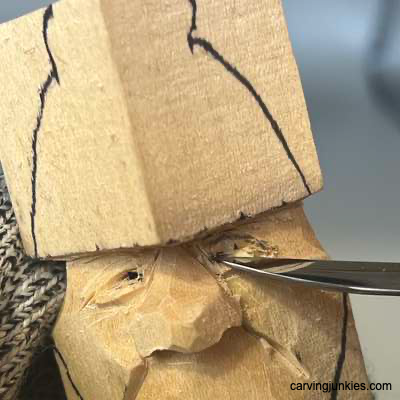 Starting pupil on acorn wood carving