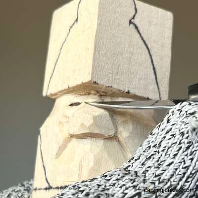 Shaping bridge of nose on acorn wood carving