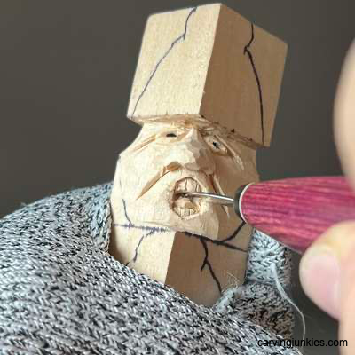 Creating tongue on acorn wood carving caricature