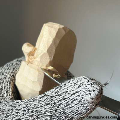 Shaping bottom back of wood carved acorn