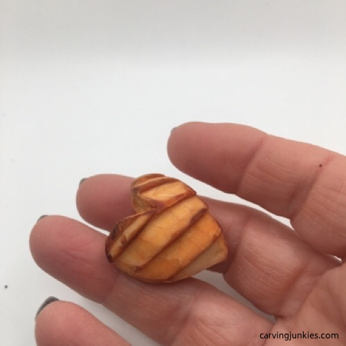 Carved avocado pit heart