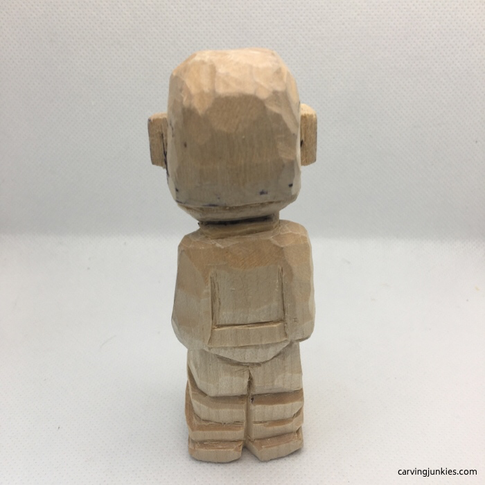 Back of caricature carved