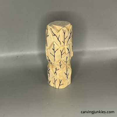 Back leaf details are added to wood green man