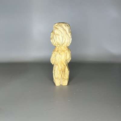 Back view of unpainted Bigfoot from a wood block
