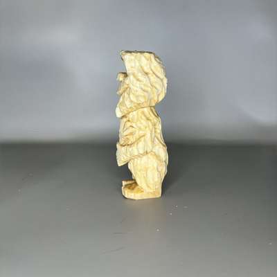 Left view of unpainted Bigfoot from a wood block