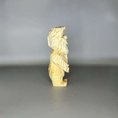 Right view of unpainted wooden Bigfoot