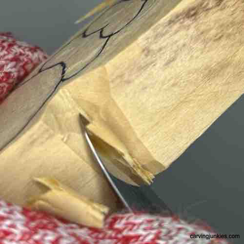 Continuing V-cuts on carved coffee scoop