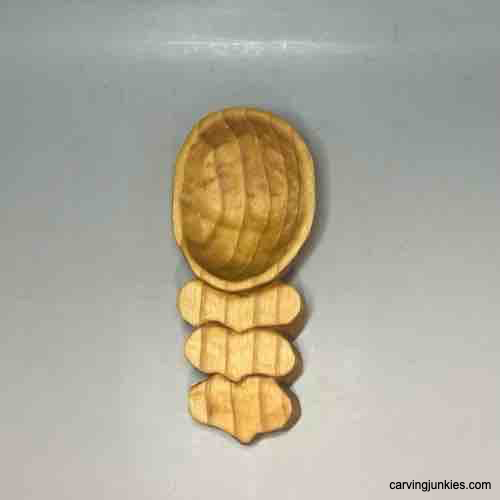 Front view of finished wood carved coffee scoop
