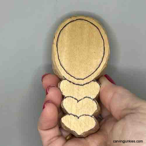 Rim is sketched on carved coffee scoop