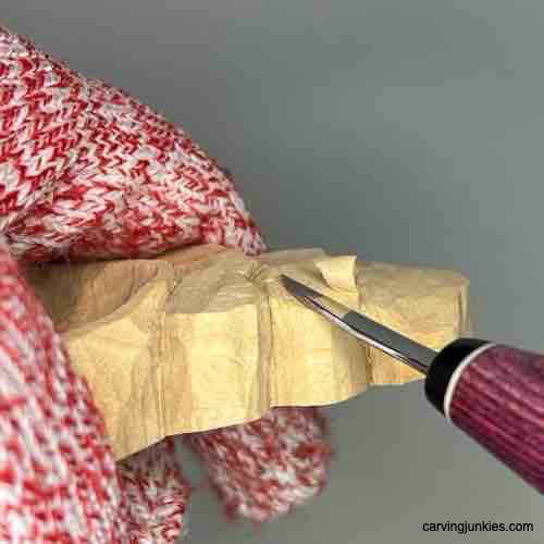 Creating angle on carved coffee scoop