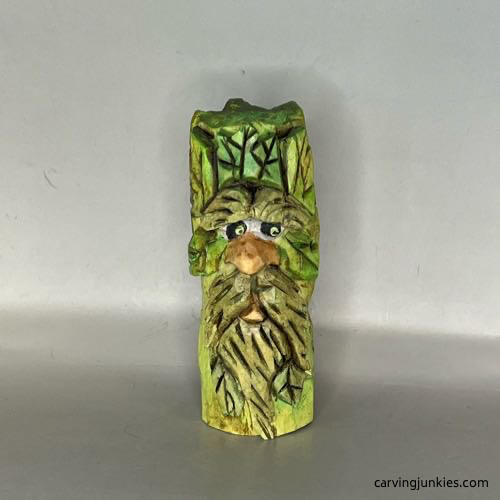 Front of painted wood carved green man