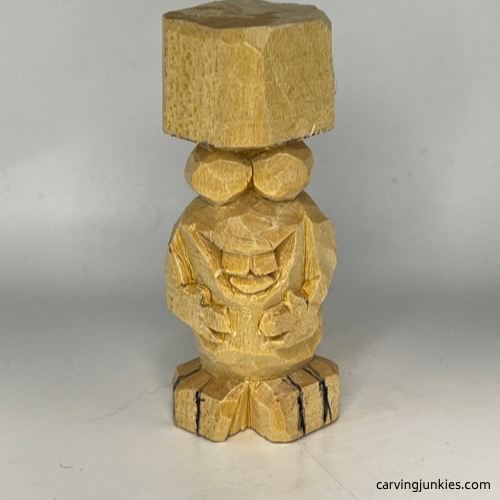 Sketched feet on carved monster toothpick holder