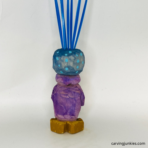 Back view of painted carved monster toothpick holder