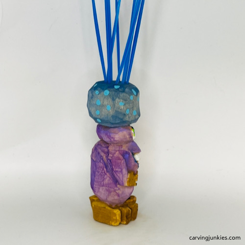 Right side of painted carved monster toothpick holder