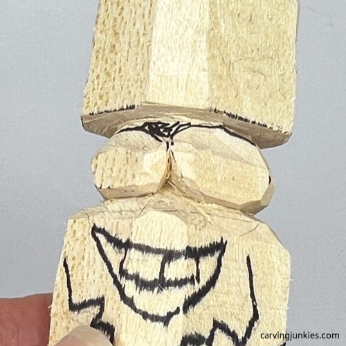 Shaping eyes on carved monster toothpick holder