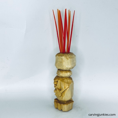 Left view of carved monster toothpick holder