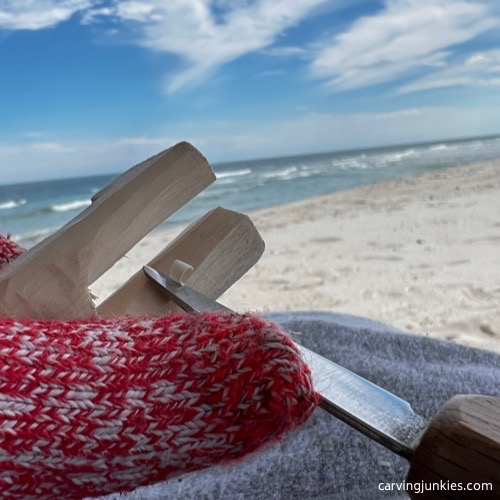 Narrowing legs on carved old man