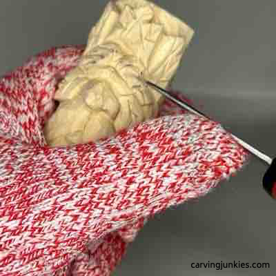 Carving eyebrows on green man