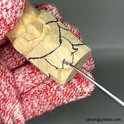 Carving top leaves on green man