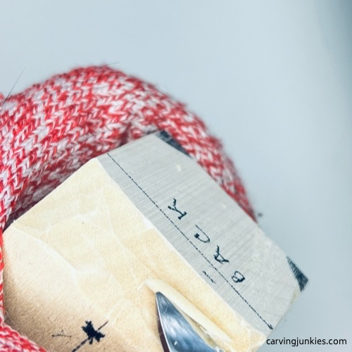 Shaping wood on wood carved fortune cookie