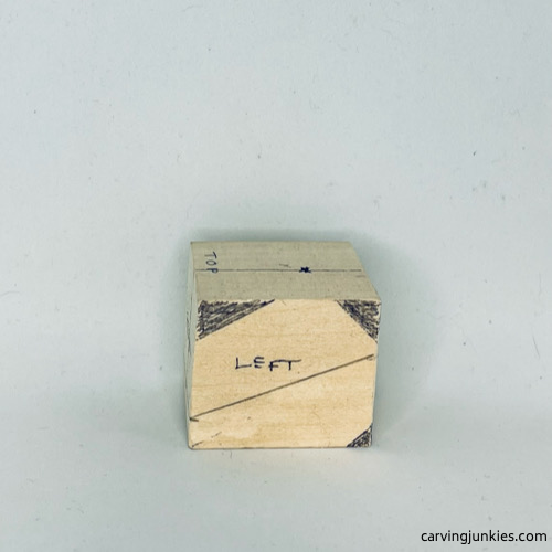 Guidelines on left side of wood carved fortune cookie