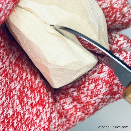 Making a V-cut on wood carved fortune cookie