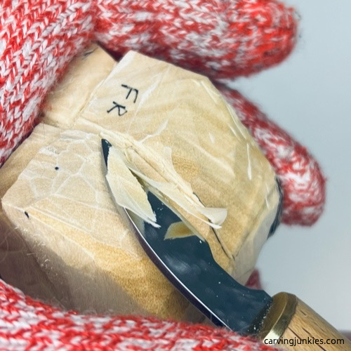 Shaping top of wood carved fortune cookie