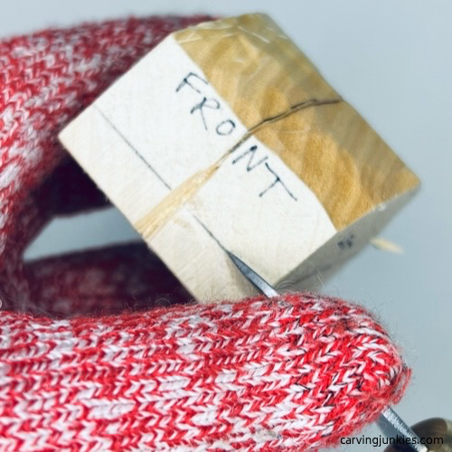 Making stop cut on wood carved fortune cookie