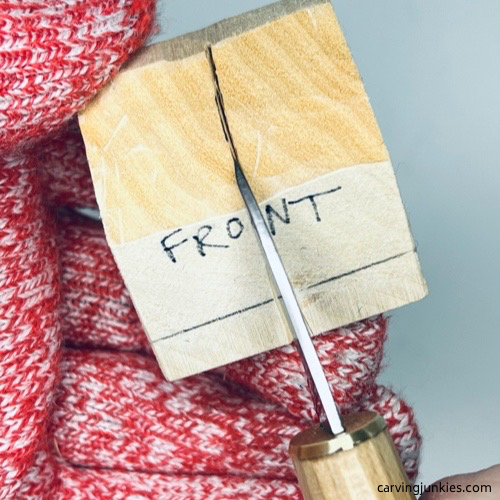 Splitting front of wood carved fortune cookie