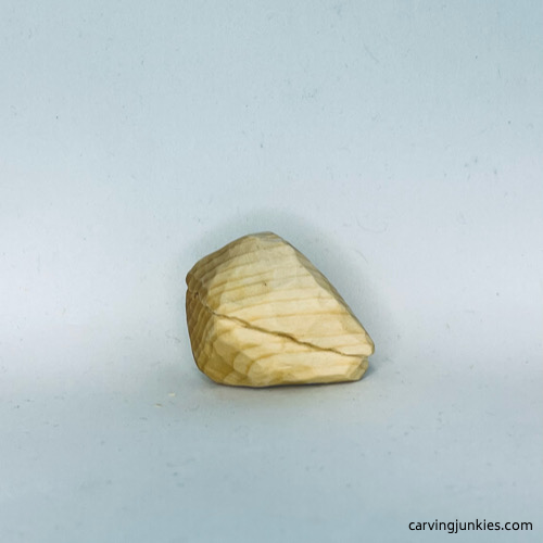 Right view of unpainted wood carved fortune cookie