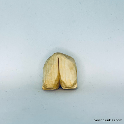 Bottom of unpainted wood carved fortune cookie