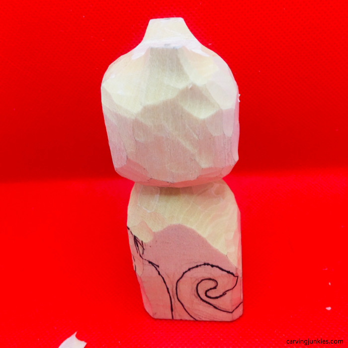 Left side view of cat carving