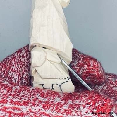 Separating face details on wooden Christmas gnome