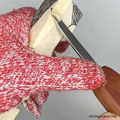 Carving hat on back of wooden Christmas gnome