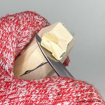 Notching the hat on wooden Christmas gnome