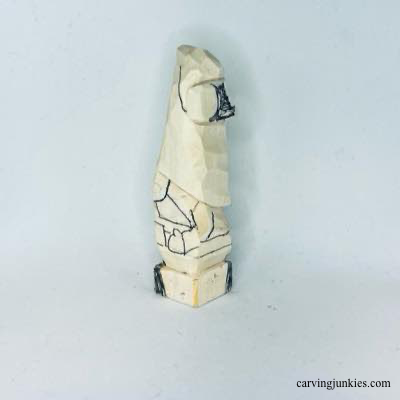 Details are on left side of wooden Christmas gnome