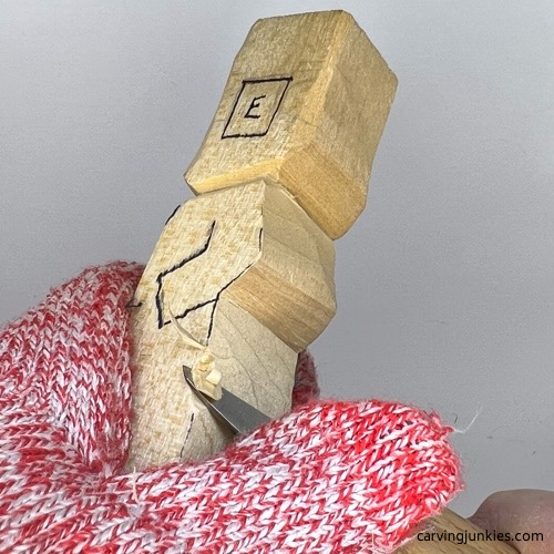 Narrow legs on wooden circus clown Tapering legs on wood circus clown
