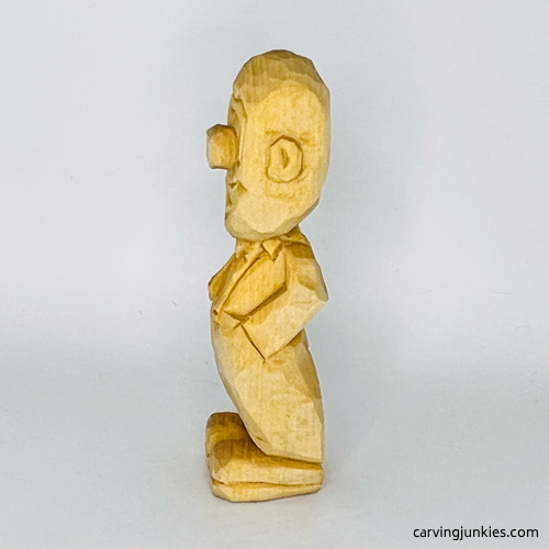 Left side of wooden circus clown unfinished Left view of wood circus clown before painting