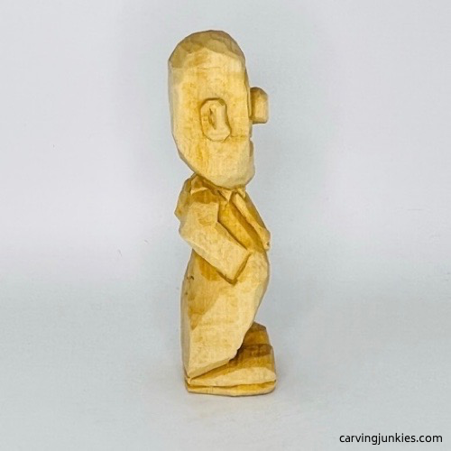 Right side of wooden circus clown unfinished Right view of wood circus clown before painting