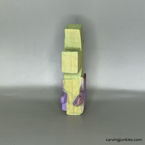 Painted left side of completed cross wood carving