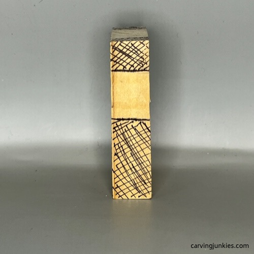 Right guidelines on wood for carving a pocket cross