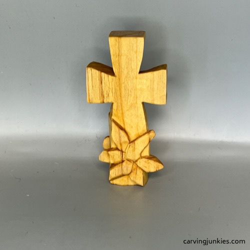 Completed back wood carved flower before painting hand carved cross