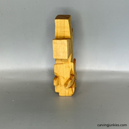 Completed left side of wood carved pocket cross prior to painting